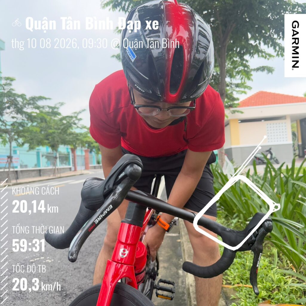 Ảnh kèm số liệu Garmin buổi đạp xe ở quận Tân Bình sáng 08/10/2026: 20,14 km, 59 phút 31 giây, tốc độ trung bình 20,3 km/h, có vẽ vòng đường trong công viên
